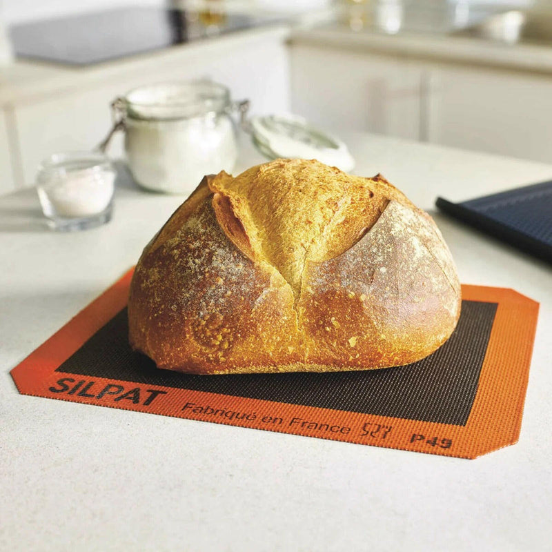 Silpat Perfect Bread Half Size mat, ideal for baking various breads and pastries, reusable and fits baking trays, offered by Athens Cooks, a specialty kitchen store.