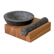 Holcomb Studio | Perch Mortar & Pestle: A textured granite mortar with a rolling pin, ideal for grinding spices, positioned on a wooden surface, showcasing its sturdy design.