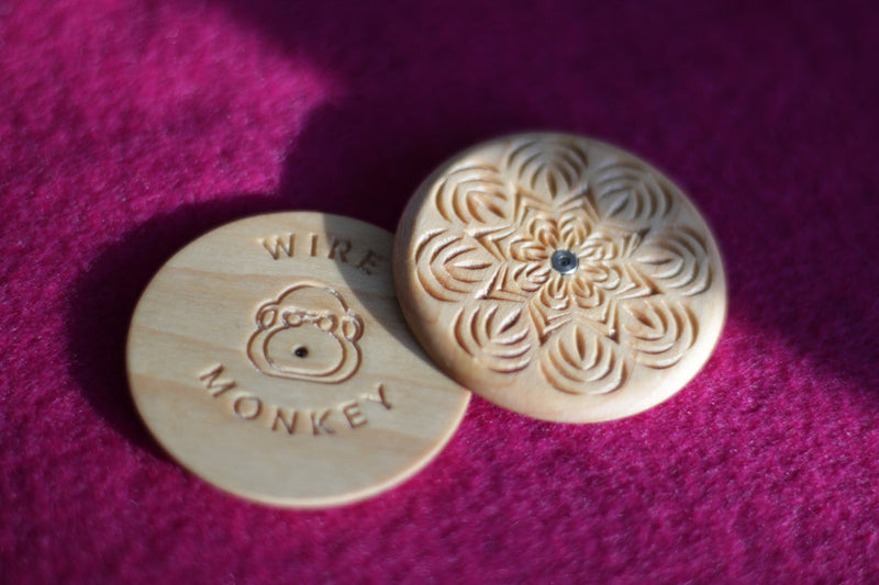 Wire Monkey | UFO Bread Journey Lame features engraved wood discs for precision bread scoring, showcasing Anna Gabur's intricate designs inspired by Moldovan traditions.