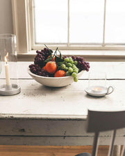 Farmhouse Pottery's 17 crafted wooden bowls, ideal for serving or decor, embody a farm-to-table ethos with a convenient nested design for easy storage.