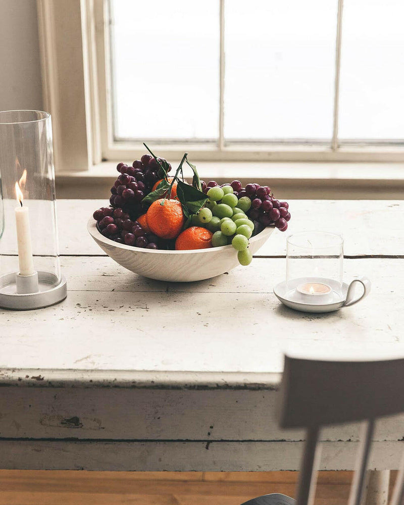 Farmhouse Pottery's 17 crafted wooden bowls, ideal for serving or decor, embody a farm-to-table ethos with a convenient nested design for easy storage.
