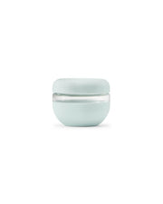 W&P Glass Seal Tight Bowl, 16 oz, features a leak-proof screw-top lid and soft silicone sleeve, perfect for transporting leftovers safely and sustainably.