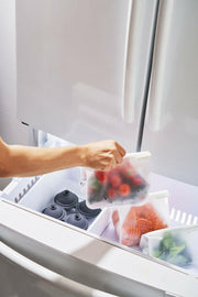 W&P Roll Tight Storage Bags set of three with bendable crimping bars for airtight sealing, ideal for organizing and preserving food in fridge or pantry.