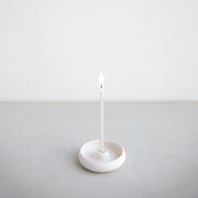 The Floral Society | Wishing Candles, Miel: A slender white candle with a small flame in a minimalist white holder, ideal for elevating everyday moments or celebrations.