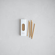 The Floral Society | Wishing Candles, Miel: Slim white box with 24 beeswax-colored taper candles, ideal for elevating everyday moments or celebrations.