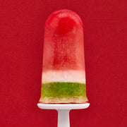 Zoku | Classic Pop Mold showcasing a red and green popsicle on a white plate, ideal for crafting homemade frozen treats.