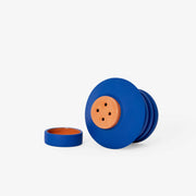 Areaware - Strata Plant Vessel: Blue, featuring a layered ceramic design inspired by sculptural objects, seamlessly integrating a concealed saucer within its form.