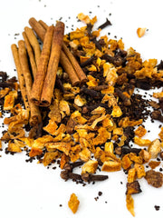 Oliver Pluff & Company - Orange Clove Hot Toddy Kit featuring cinnamon sticks, orange peel, cloves, and chicory, perfect for crafting a warming winter beverage.