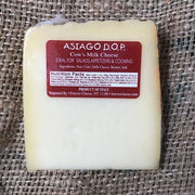 Nicola's Marketplace - Asiago D’Allevo DOP Mitica®: 7 ounces wedge, semi-firm cow’s milk cheese from Italy with red label detailing ingredients and nutritional facts. Ideal for culinary use.