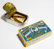 Fishwife - Sardines with Preserved Lemon in an opened tin beside its colorful carton, showcasing premium sardines packed in Spanish olive oil, perfect for culinary creations.