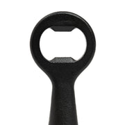 L'Atelier du Vin - USA - Bottle Opener - LE BRASSEUR – BLACK: Person-shaped stainless steel bottle opener with PVD skin and embossed synthetic leather disc, ideal for effortless bottle opening.
