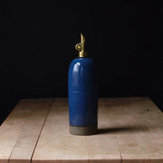 Rose Line Pottery Oil Bottle - Denim Blue, 22 oz; handcrafted, brass pump, ideal for olive oil or vinegar, showcasing traditional craftsmanship from Dover-Foxcroft.