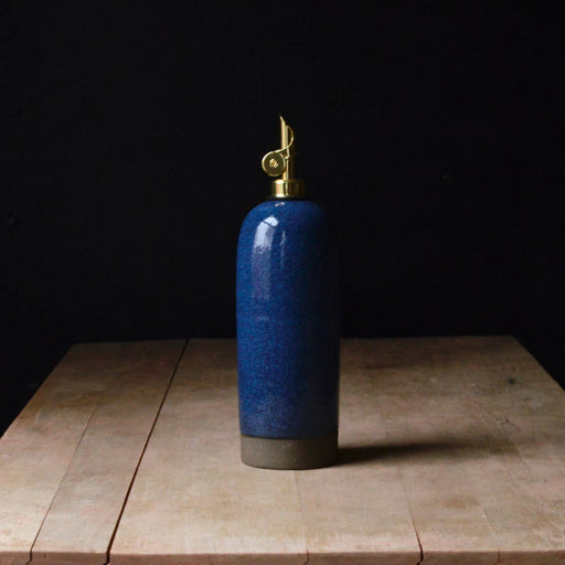 Rose Line Pottery Oil Bottle - Denim Blue, 22 oz; handcrafted, brass pump, ideal for olive oil or vinegar, showcasing traditional craftsmanship from Dover-Foxcroft.