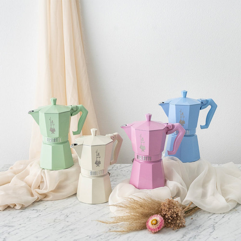 Bialetti | Cream Moka Express Exclusive - 6 Cup on marble-look surface, showcasing vintage-style design with pastel hues and elegant finishes.