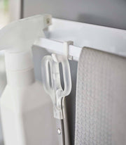 Yamazaki Home - Magnetic Kitchen Towel Hanger in white, displaying a clip-on hook system holding scissors and a cloth for efficient kitchen organization.