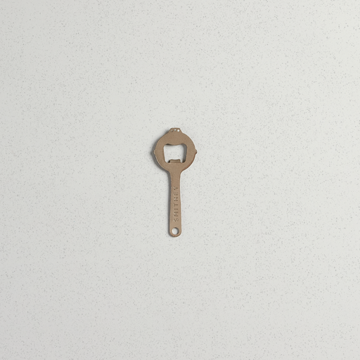 Smithey bottle opener, complete skillet-shaped profile on a light background