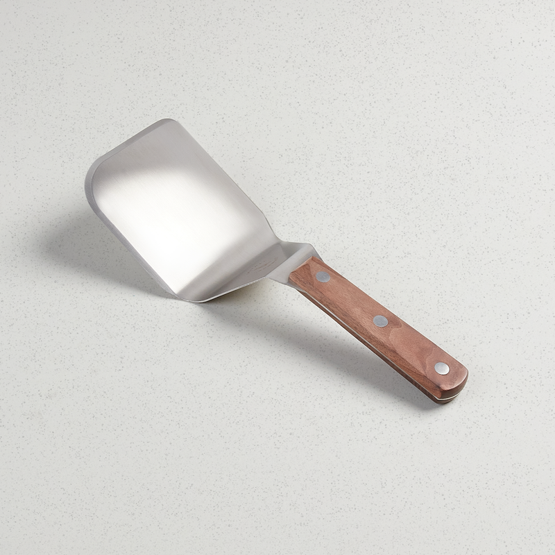 Smithey Mighty Spatula with broad stainless steel blade and riveted walnut handle