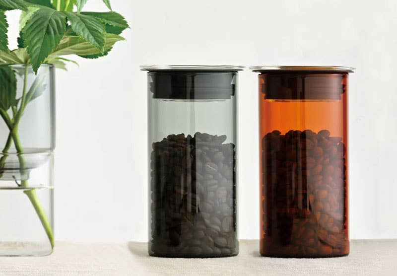 HARIO USA - HARIO Colors Glass Canister, 400ml: Amber, featuring heatproof glass and silicone seal, stores coffee beans stylishly, enhancing your kitchen's functionality and aesthetics.