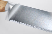 Wüsthof | Amici 9 Double Serrated Bread Knife, close-up of blade and handle, showcasing precision craftsmanship ideal for kitchen use.