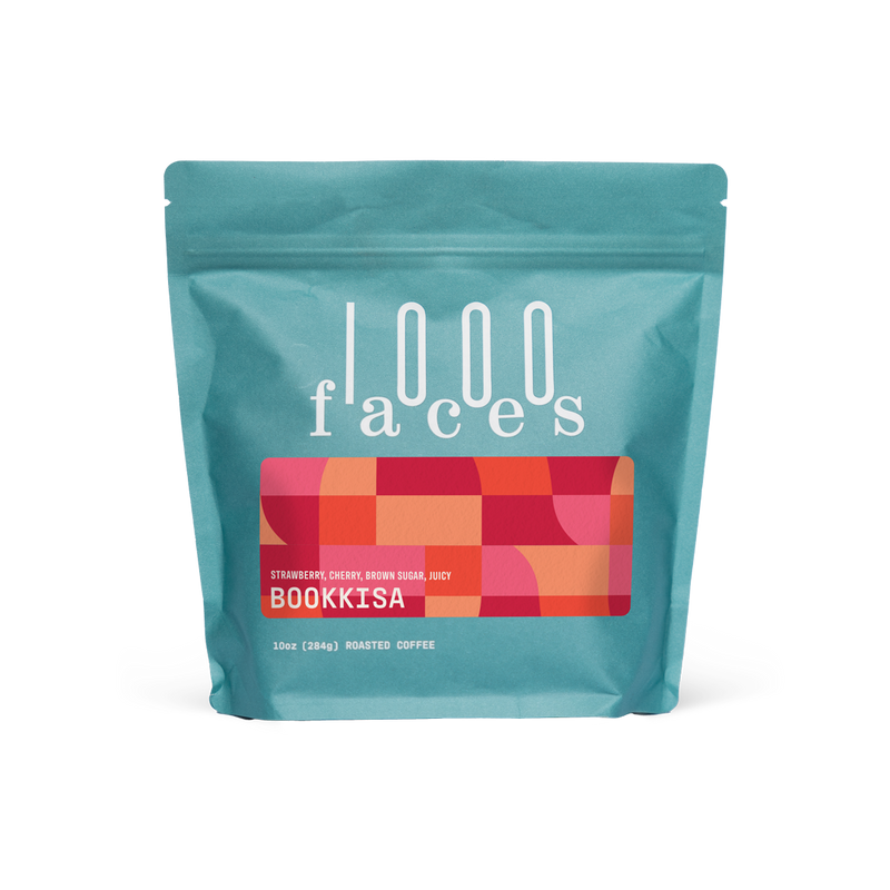 Blue bag of 1000 Faces Coffee - Bookkisa, featuring white text and red squares, highlighting exceptional blends for mindful coffee consumption.