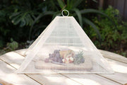 NEEPA HUT | Collapsible Woven Food Tent - Rose Pink, elegantly covers food, showcasing a unique pentagon shape, perfect for stylish outdoor dining and supporting Filipino artisans.