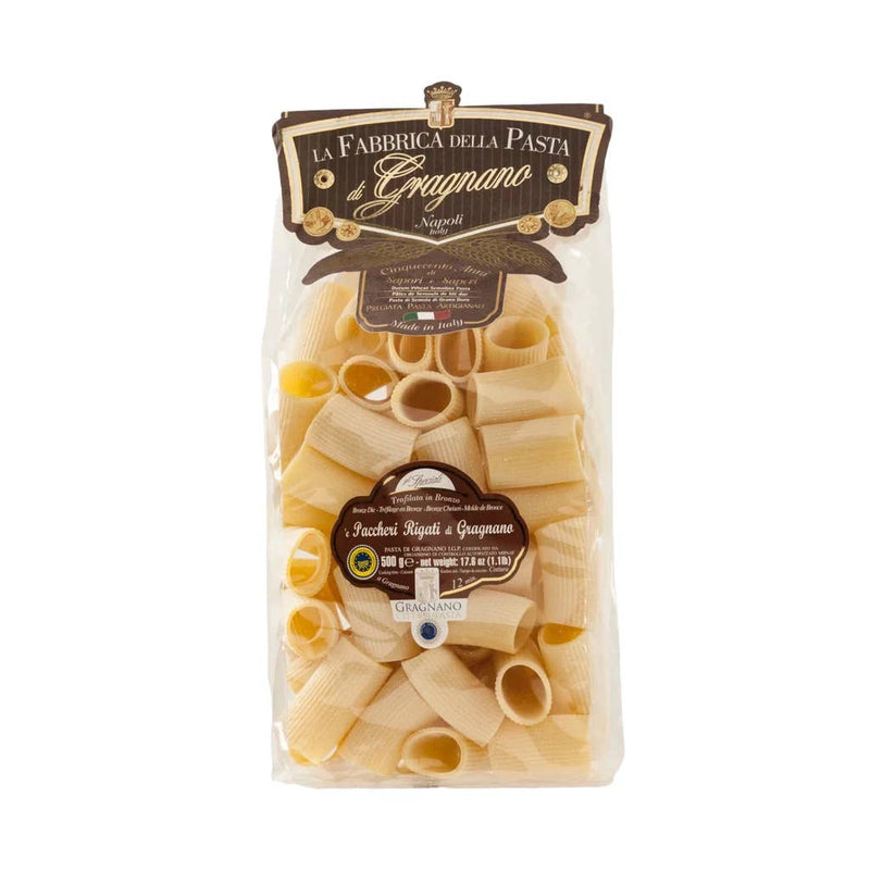 Zia Pia - Paccheri Rigati by La Fabbrica della Pasta: A clear package of artisanal, ridged tube pasta from Gragnano, Italy, weighing 500g.