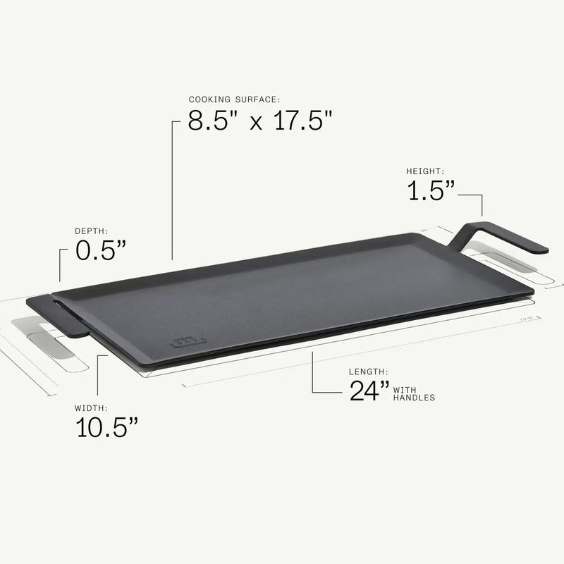 Made In | Carbon Steel Griddle, flat cast-iron design with handles, 24 length, pre-seasoned surface, ideal for versatile dual-zone cooking on various stovetops.