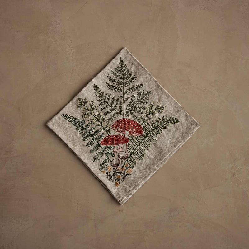 Coral & Tusk - Mushrooms and Ferns Bouquet Dinner Napkin, showcasing embroidered amanitas and ferns, perfect for enhancing a fairytale table setting with natural elegance.