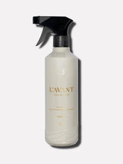 L'AVANT Collective - Fresh Linen Multipurpose Cleaner in a white spray bottle with black lid, featuring gold text. Ideal for kitchen and bathroom surfaces.