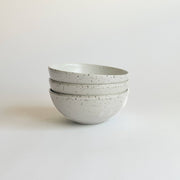 Sarah Kersten - Ramen Bowl: Black, a versatile ceramic bowl ideal for noodles, salads, and more, displayed in a stack on a white surface.