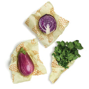 Bee's Wrap - Large 3 Pack Wraps encasing assorted vegetables, showcasing its versatility for preserving produce in the kitchen.