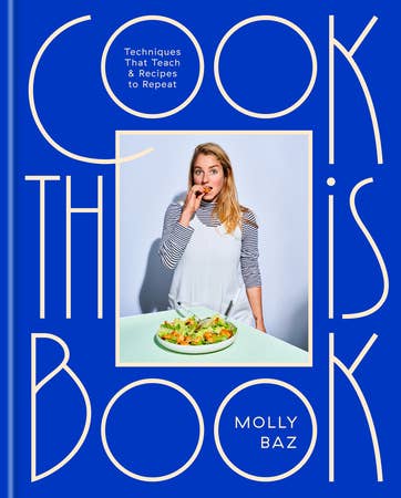 Cookbook cover: Cook This Book by Molly Baz features the author with salad, highlighting techniques and recipes for confident home cooking, available at Athens Cooks.