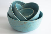 RachaelPots - Laura Bowl: White, a set of nested ceramic bowls with a turquoise-blue glaze and brown speckles, crafted for versatile meal-serving needs.