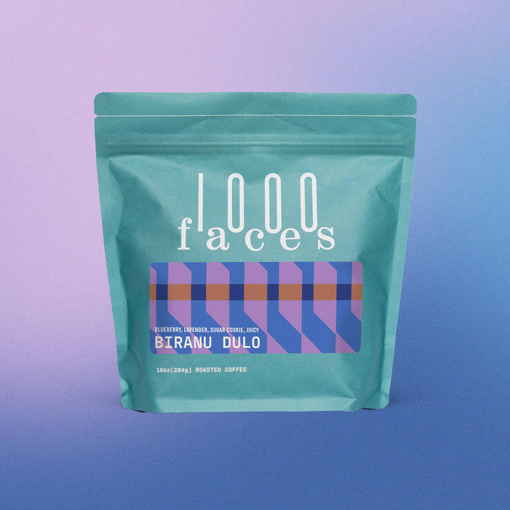 1000 Faces | Biranu Dulo: Teal pouch of Ethiopian coffee with notes of blueberry, lavender, and sugar cookie; 10 oz pack from Athens Cooks.