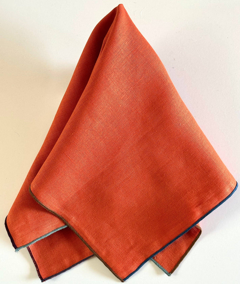 Tisch New York - Napkins, Tomato Linen (Night Fall Hem), neatly folded with contrasting stitched edging, perfect for elegant dining setups. Sold in sets of four.