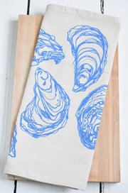 Hearth and Harrow - Oyster Tea Towel in Blue-violet, organic cotton, features a blue-violet oyster design, hand-printed on the bottom half, with a hanging loop.