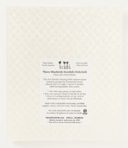 Three Bluebirds Swedish Dishcloths - Cornflowers Swedish Dishcloth with label and bird design, featuring a durable, eco-friendly fabric for versatile kitchen use.