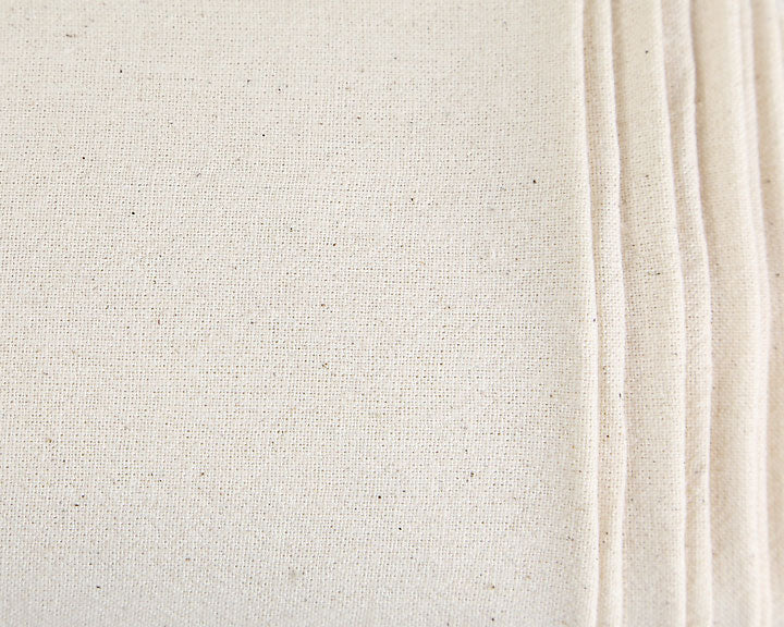Close-up of Breadtopia | Organic Flour Sack Towels, showcasing the unbleached canvas texture, highlighting their soft, lint-free, and absorbent qualities, ideal for versatile home use.
