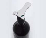 L'Atelier du Vin - USA - Chromed Foil Cutter for Wine Bottles on a neck, showcasing its three-arm design and precision blades for clean foil removal.