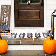 Carolina Creekhouse - Fab-Boo-Lous FloorFlat: Fab-Boo-Lous Orange / 2'x3' features a ghost-print doormat adding charm to a Halloween-themed entryway with pumpkins and decor.