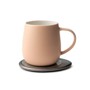 OHOM - Ui 3 Self-heating Mug Set: Jasmine White on a metal warming base, showcasing its sleek, modern design and innovative self-heating and wireless charging features.
