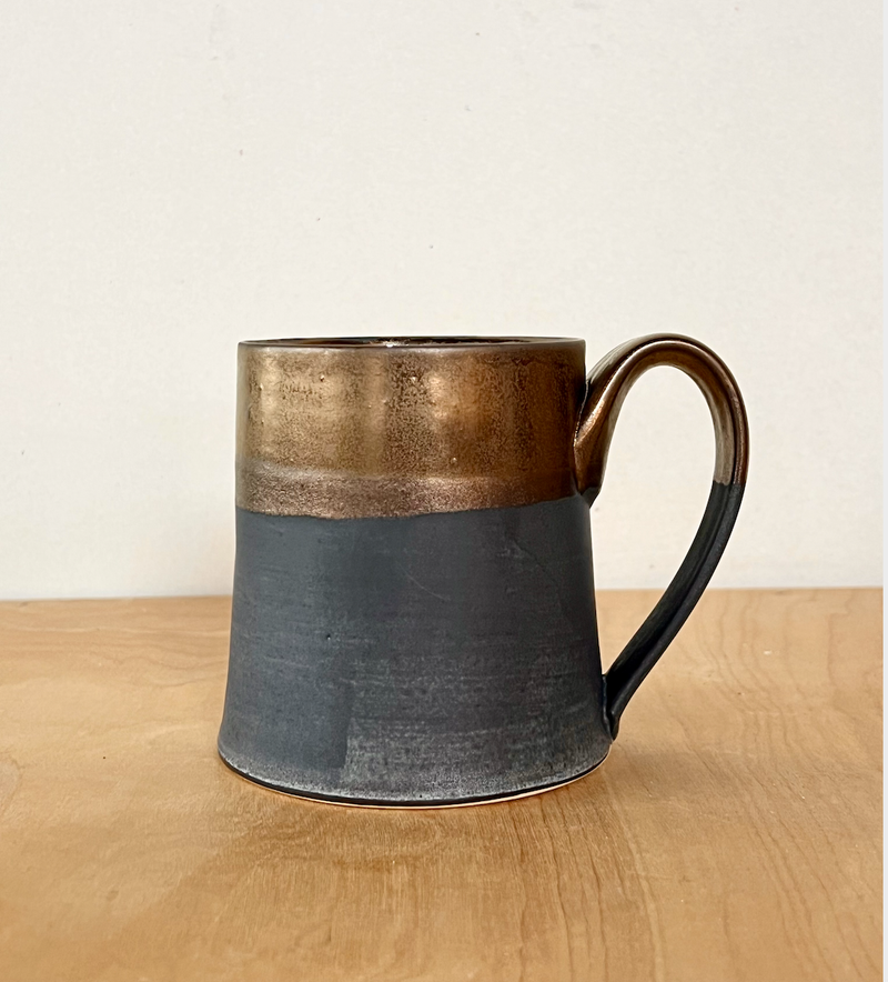 Jessica Wertz Ceramics - Black + Gold Mug, featuring a handmade two-tone glaze with metallic bronze and matte charcoal, holds 12 ounces and is dishwasher safe.