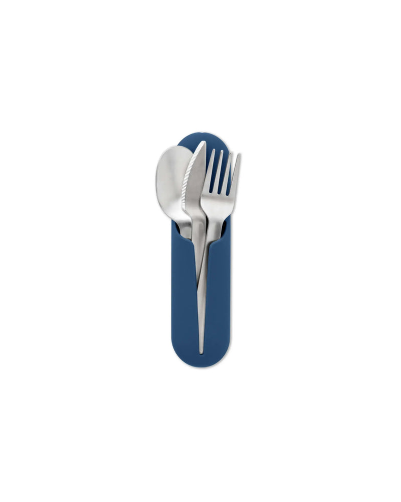W&P - Stainless Steel Utensils Set in Silicone Carry Case: Terrazzo Charcoal, featuring a spoon, fork, and knife in a blue silicone holder.
