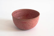 RachaelPots - Laura Bowl: Sage, a handcrafted round ceramic bowl with a mottled pinkish-red glaze, featuring a ribbed exterior for easy grip.