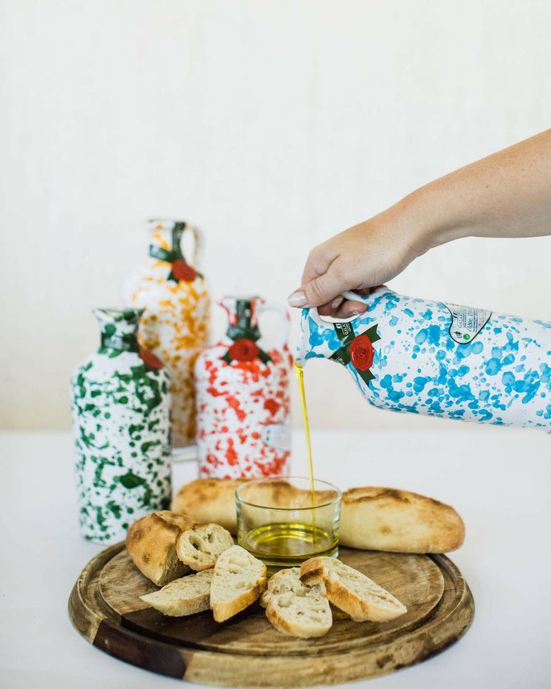 Frantoio Galantino | Extra Virgin Olive Oil in Ceramic Jug - Bordeaux Ceramic Jug, hand-painted, held by a person, showcasing its artisanal design and premium quality.