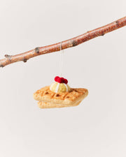 Farmhouse Pottery - Felted Breakfast Ornament: Pancake Stack hanging from a twig, handcrafted from wool, resembling stacked waffles with cream and a berry accent.