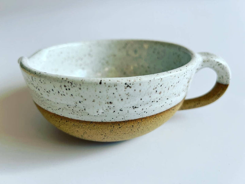 RachaelPots - Salad Dressing Bowl: Coral, a handcrafted stoneware bowl featuring a garlic scraper, handle, and pour spout, ideal for dressings or guacamole.