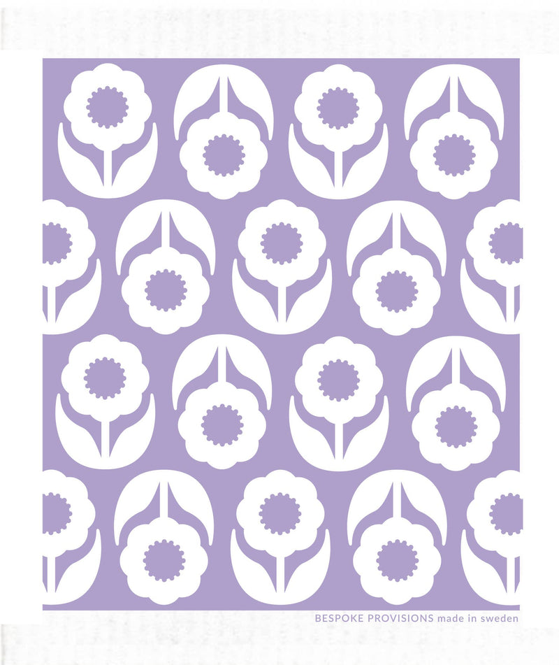 Bespoke Provisions - Flowers on Lavender Swedish Dishcloth with a purple and white floral pattern, ideal for eco-friendly cleaning in kitchens.