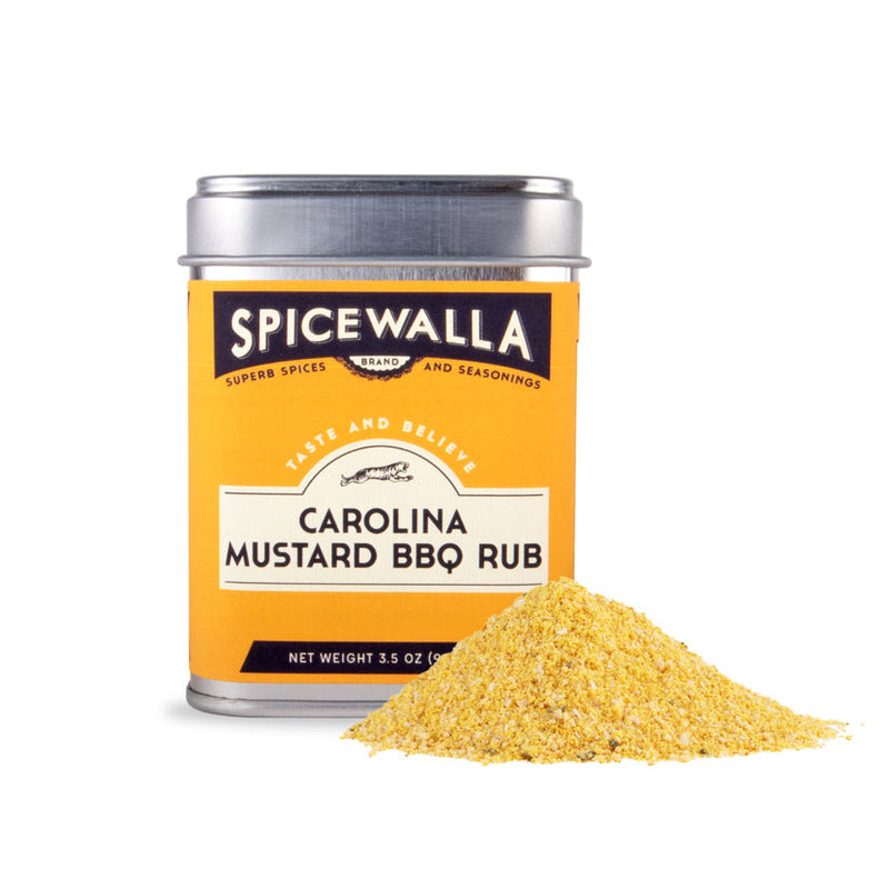 Spicewalla | Carolina Mustard BBQ Rub tin with a mound of yellowish spice blend, showcasing a smokey, mustard-infused mix perfect for enhancing meats and salads.