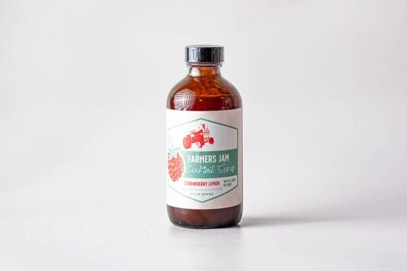 Farmers Jam | Strawberry Lemonade Cocktail Syrup - 8oz bottle with a red tractor and strawberry label, ideal for cocktails, supporting local farms.